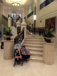 Miaomiao and Max in front of the staircase in the lobby of the Grande Centre Point Hotel Ratchadamri Bangkok