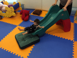 Miaomiao and Max on a slide in the Play Room of the Grande Centre Point Hotel Ratchadamri Bangkok