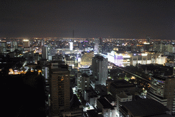 The Royal Bangkok Sports Club golf course, the Siam Paragon shopping mall, the Wat Pathumwanaram Ratchaworawihan temple, the Wat Saket temple and skyscrapers in the Central Business District, viewed from our room at the Grande Centre Point Hotel Ratchadamri Bangkok, by night