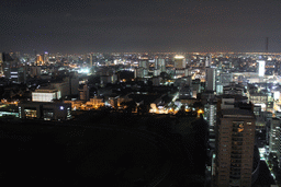 The Royal Bangkok Sports Club golf course, the Wat Saket temple and skyscrapers in the city center, viewed from our room at the Grande Centre Point Hotel Ratchadamri Bangkok, by night