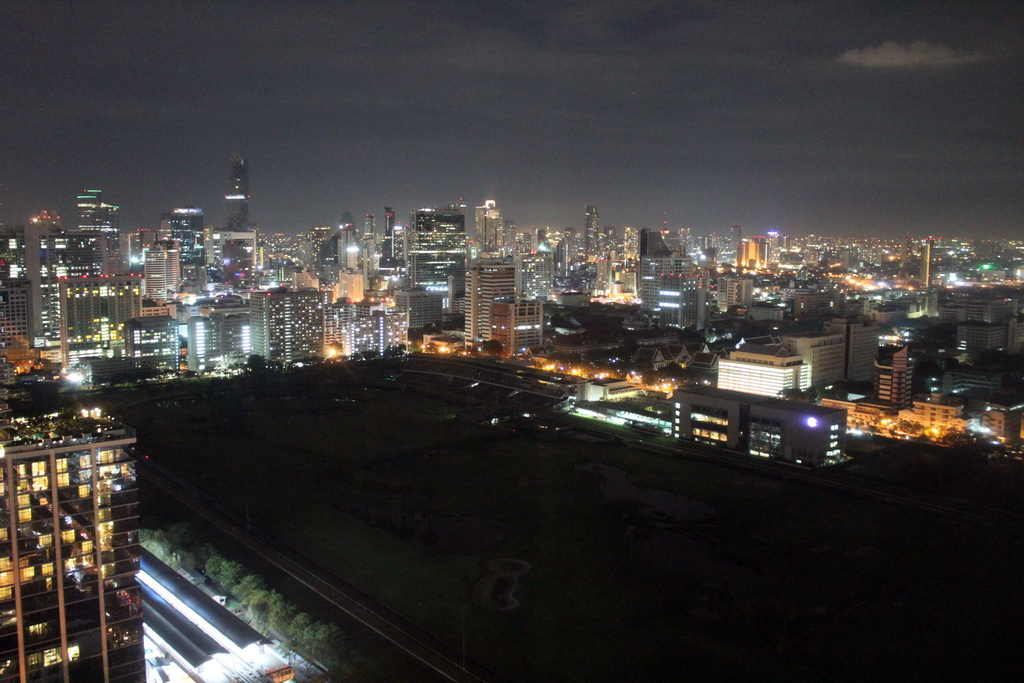 The Royal Bangkok Sports Club golf course, Chulalongkorn University, the MahaNakhon building, the State Tower and other skyscrapers in the city center, viewed from our room at the Grande Centre Point Hotel Ratchadamri Bangkok, by night