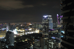 The Siam Paragon shopping mall, the Wat Pathumwanaram Ratchaworawihan temple, the Central World Tower, the Centara Grand & Bangkok Convention Centre and other skyscrapers in the Central Business District, viewed from our room at the Grande Centre Point Hotel Ratchadamri Bangkok, by night