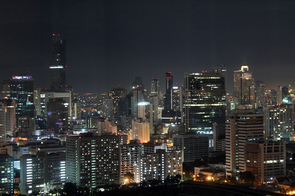 The MahaNakhon building, the State Tower and other skyscrapers in the city center, viewed from our room at the Grande Centre Point Hotel Ratchadamri Bangkok, by night