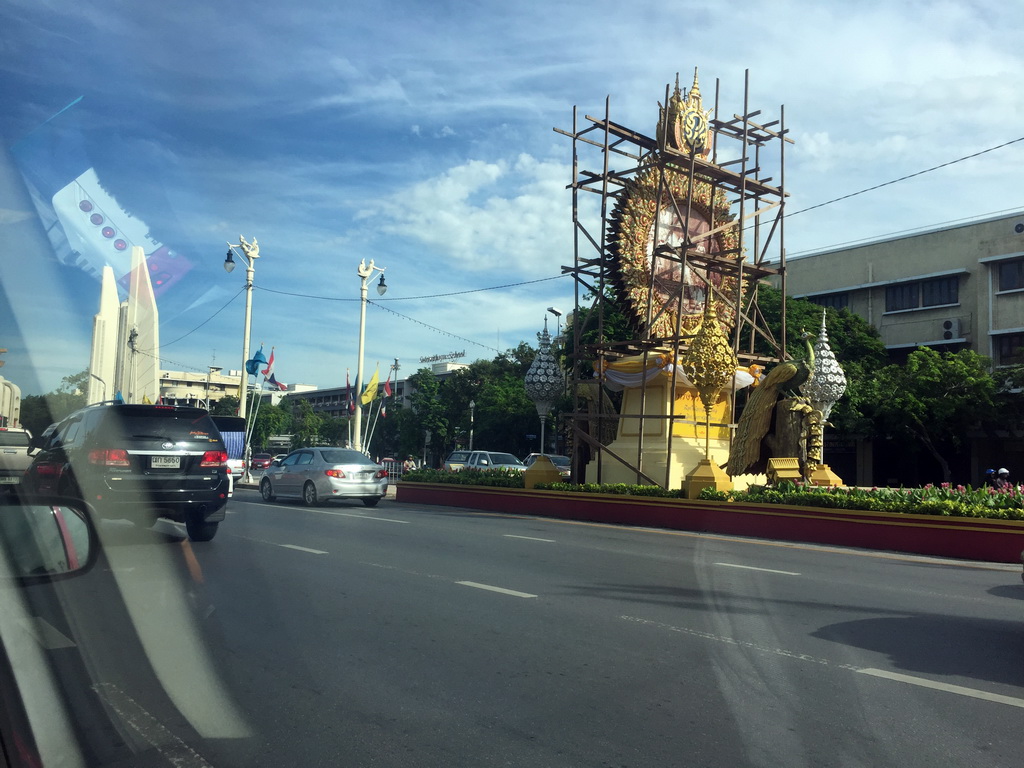 The Democracy Monument and another monument, under renovation, at Ratchadamnoen Klang Road, viewed from the taxi