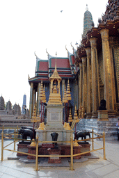 Column with elephants in front of the Phra Mondop hall and the Prasat Phra Dhepbidorn hall at the Temple of the Emerald Buddha at the Grand Palace