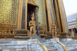 Yaksha statues in front of the Phra Mondop hall at the Temple of the Emerald Buddha at the Grand Palace