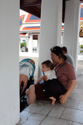 Miaomiao and Max at a gallery in front of the Dusit Maha Prasat hall at the Grand Palace