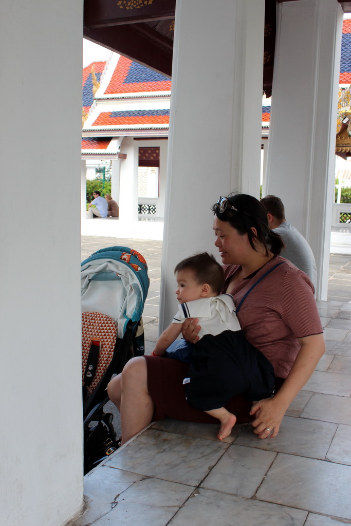 Miaomiao and Max at a gallery in front of the Dusit Maha Prasat hall at the Grand Palace