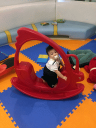 Max on a rocker in the Play Room of the Grande Centre Point Hotel Ratchadamri Bangkok