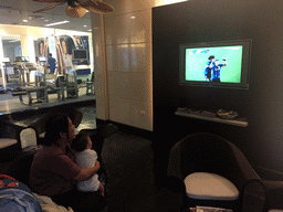 Miaomiao and Max watching television in the lobby of the swimming pool at the Grande Centre Point Hotel Ratchadamri Bangkok