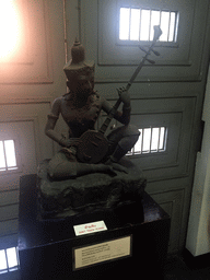 Statue of the Musisian God, at the Thai Fine Art room at the Ground Floor of the Praphat Phiphitthaphan Building at the Bangkok National Museum, with explanation