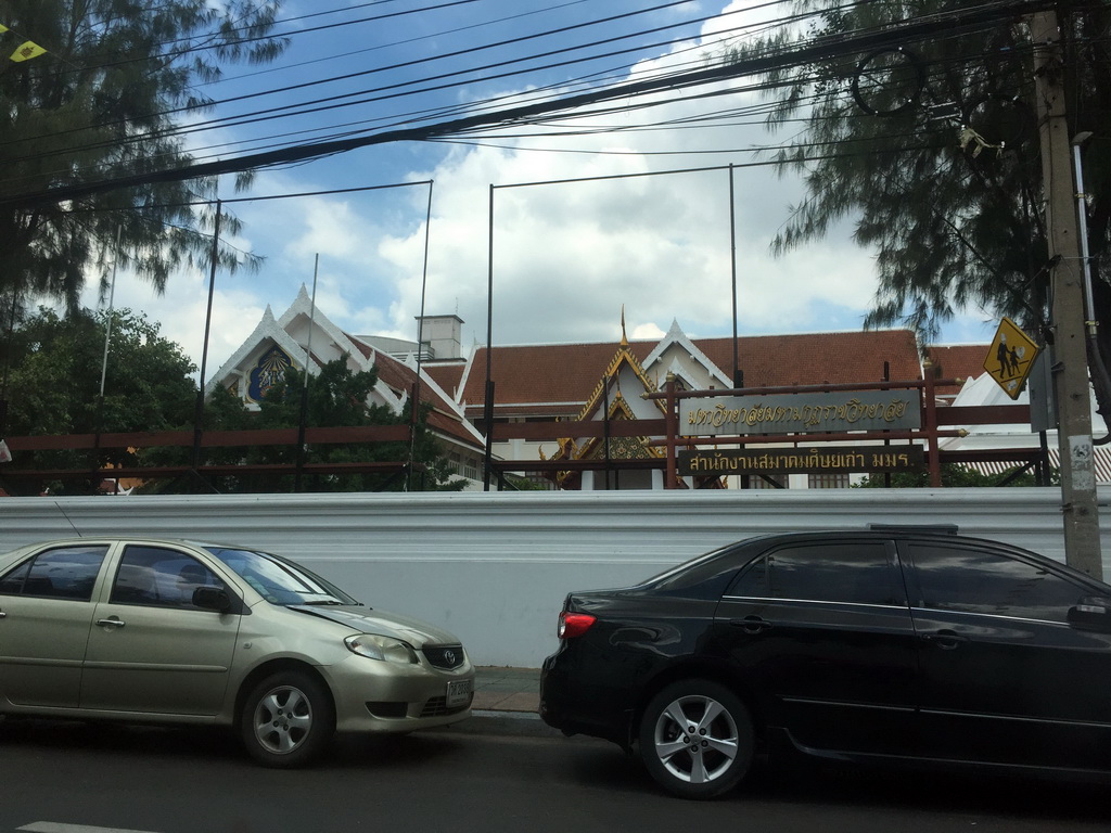 Northeast side of the Wat Bowonniwet Vihara Rajavaravihara temple complex at Phra Sumen Road, viewed from the taxi