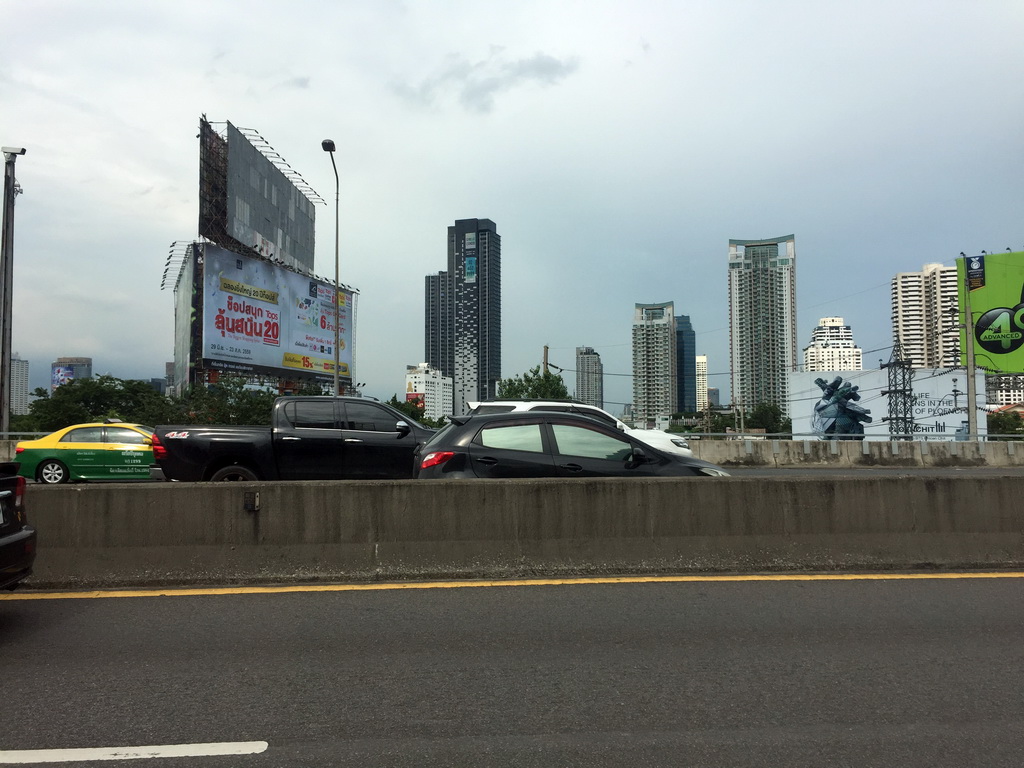 The Chalerm Maha Nakhon Expressway and skyscrapers in the city center, viewed from the taxi