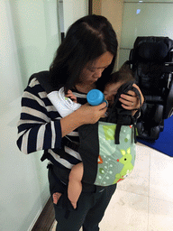 Miaomiao feeding Max in the business class lounge of China Airlines at Bangkok Suvarnabhumi Airport