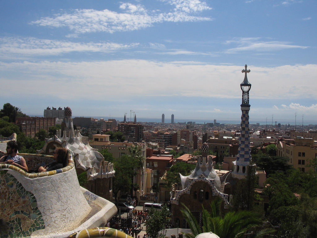 View from Park Güell on the tower of the entrance building, the city center and the towers of the Sagrada Família church