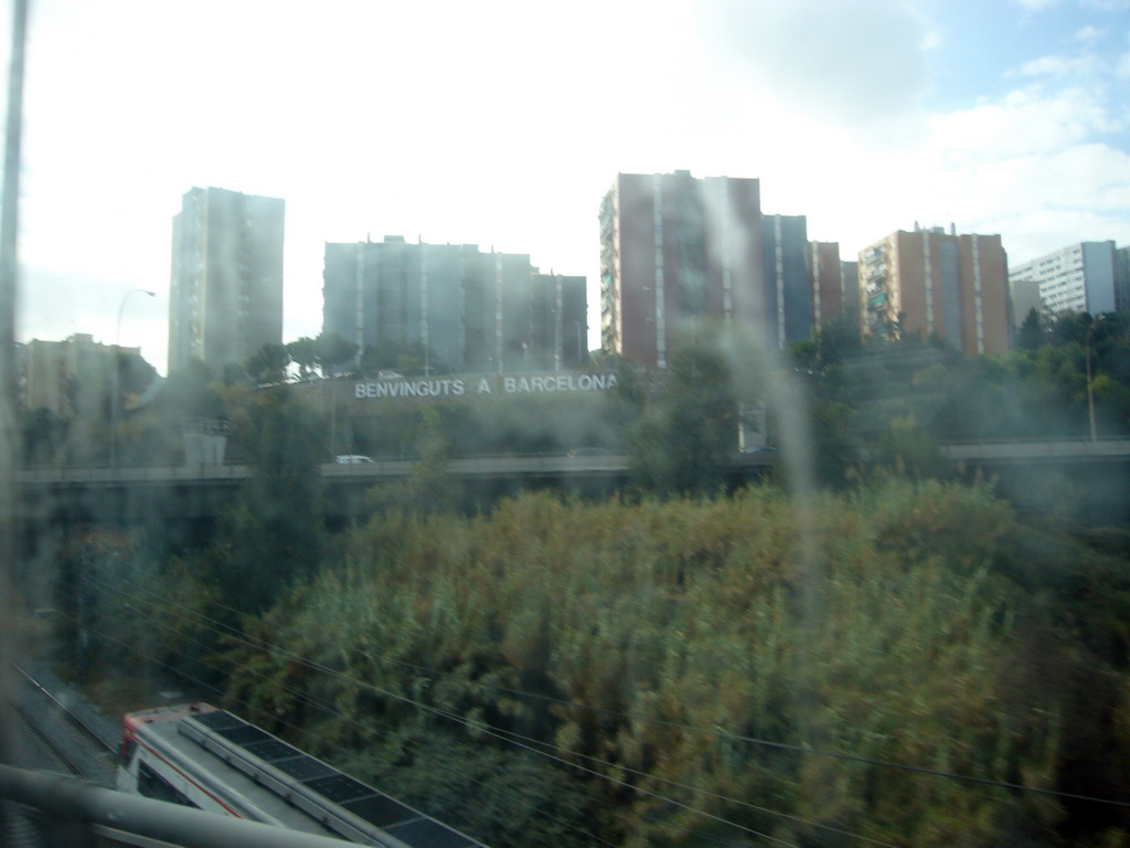 `Benvinguts a Barcelona` sign at Santelvira, viewed from the bus on the way from Barcelona Girona Airport to the Estació del Nord bus station