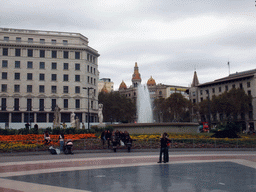 Fountain at the Plaça de Catalunya square, and the Novedades Theater