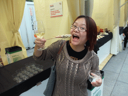 Miaomiao with food and wine at the `Mercat de Mercats` market at the Plaça Nova square