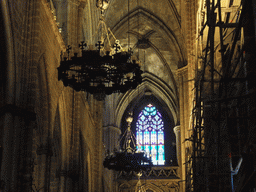 Chandeleers and stained glass window at the southwest nave of the Cathedral of Santa Eulalia