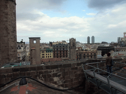 Miaomiao at the roof of the Cathedral of Santa Eulalia, with a view on the region to the northeast, with the Palau Reial Major, the Hotel Arts tower and the Torre Mapfre tower