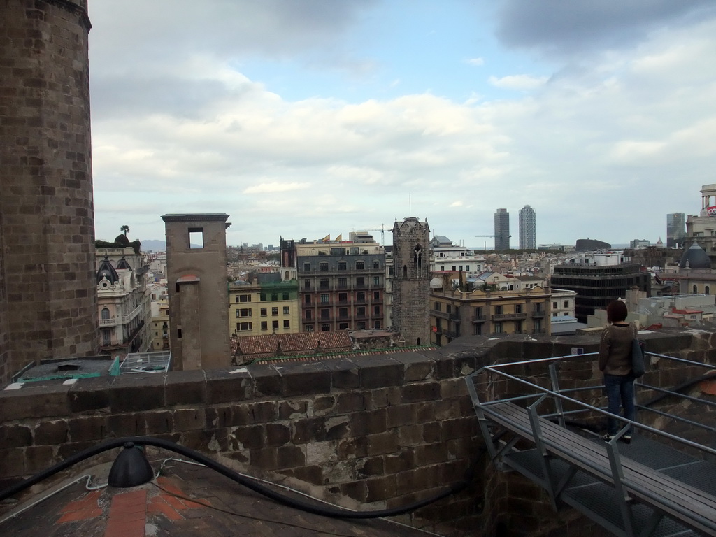 Miaomiao at the roof of the Cathedral of Santa Eulalia, with a view on the region to the northeast, with the Palau Reial Major, the Hotel Arts tower and the Torre Mapfre tower