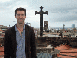 Tim with the cross at the roof of the Cathedral of Santa Eulalia, with a view on the region to the southeast, with the tower of the Basílica dels Sants Màrtirs Just i Pastor church and the W Barcelona building