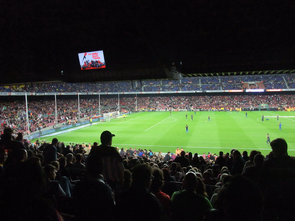 Players doing the warm-up just before the football match FC Barcelona - Sevilla FC in the Camp Nou stadium