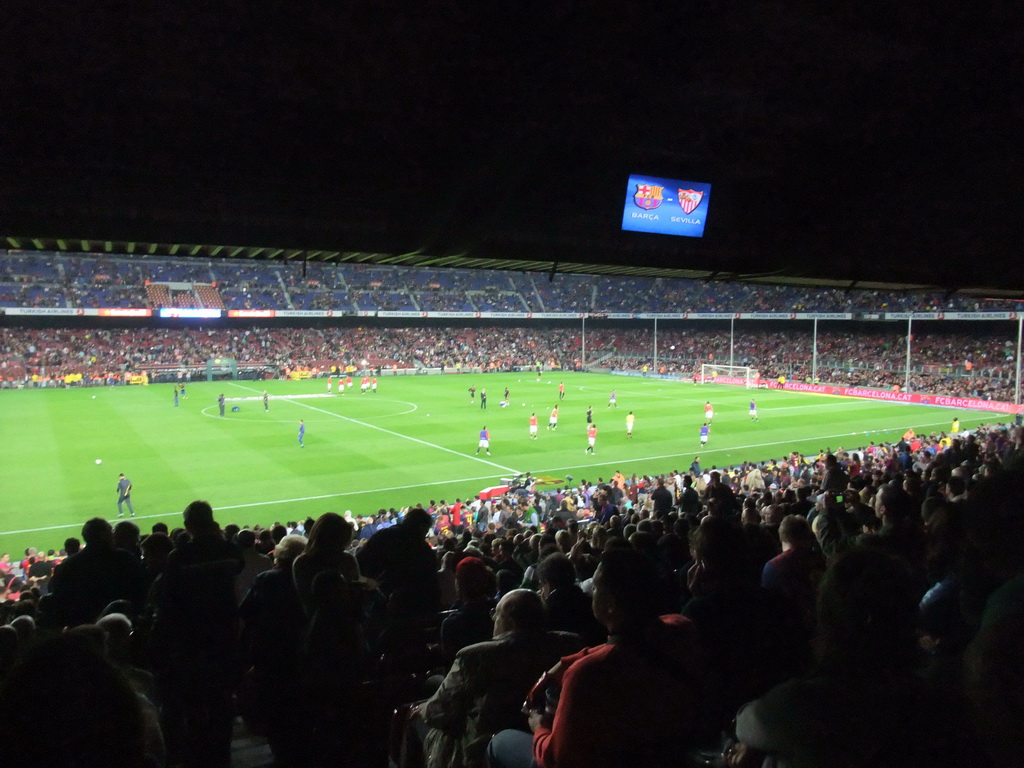 Players doing the warm-up just before the football match FC Barcelona - Sevilla FC in the Camp Nou stadium