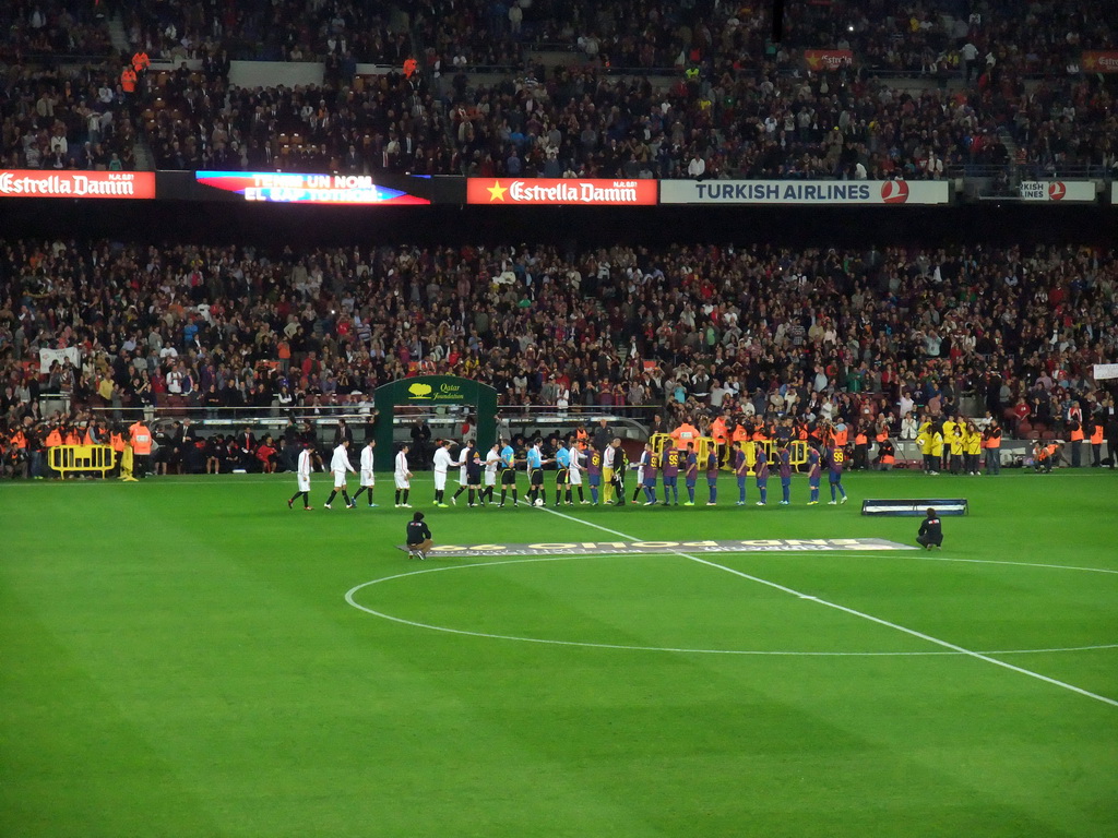 Players shaking hands at the start of the football match FC Barcelona - Sevilla FC in the Camp Nou stadium