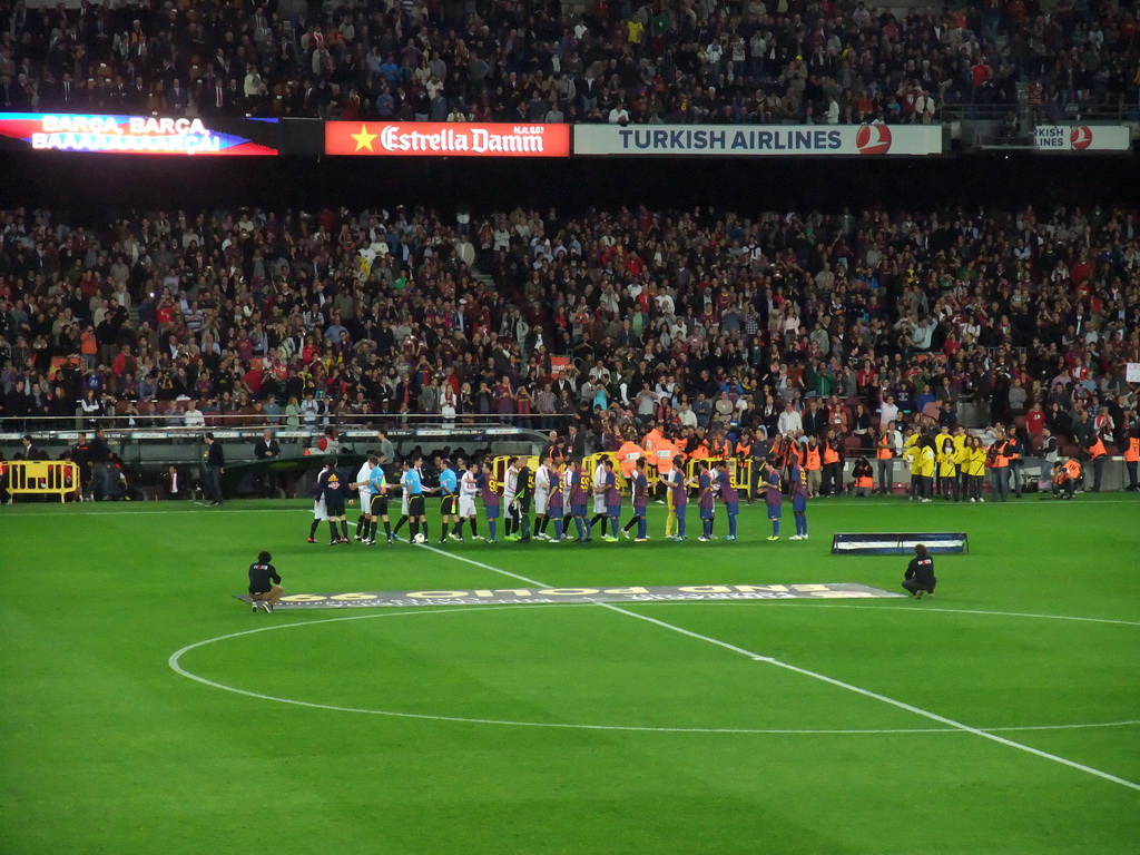 Players shaking hands at the start of the football match FC Barcelona - Sevilla FC in the Camp Nou stadium