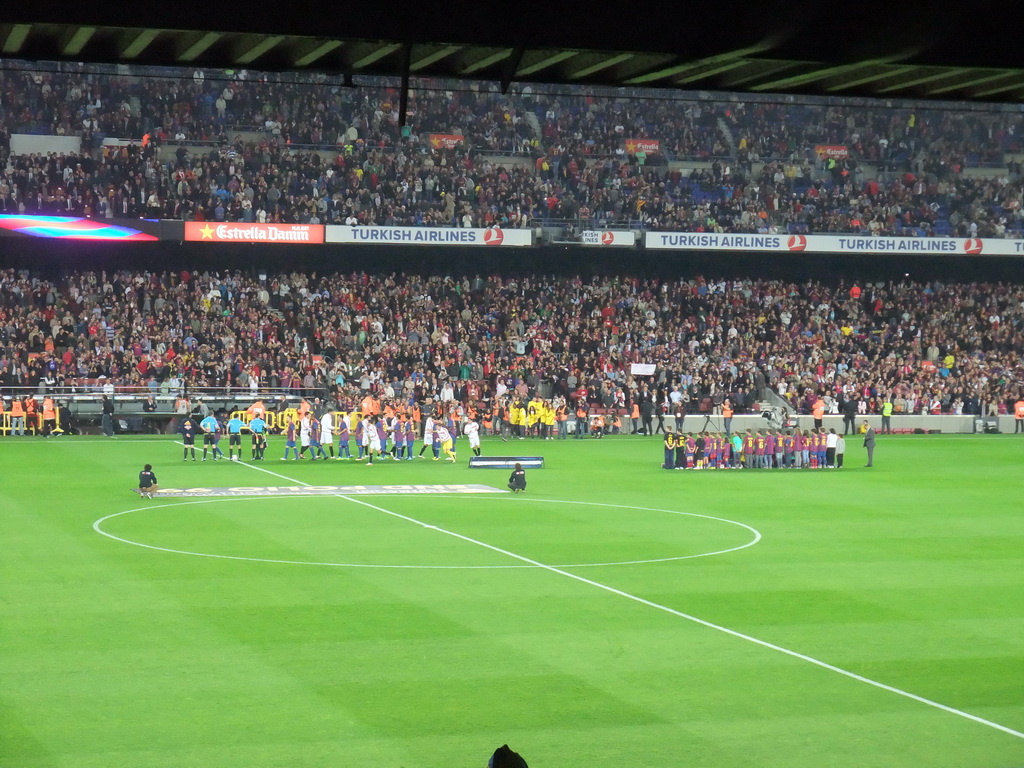 Players shaking hands at the start of the football match FC Barcelona - Sevilla FC in the Camp Nou stadium