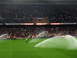 Field being sprayed during halftime at the football match FC Barcelona - Sevilla FC in the Camp Nou stadium