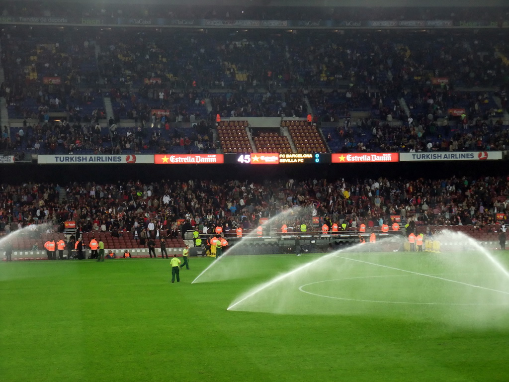 Field being sprayed during halftime at the football match FC Barcelona - Sevilla FC in the Camp Nou stadium