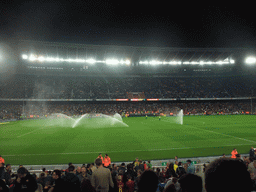 Field being sprayed during halftime at the football match FC Barcelona - Sevilla FC in the Camp Nou stadium