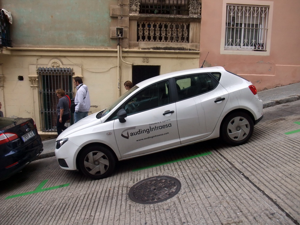 Car parked on a slope at the Baixada de la Glòria street