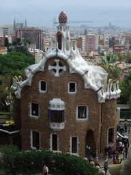 The east entrance building of Park Güell, with a view on the city center with the Sagrada Família church