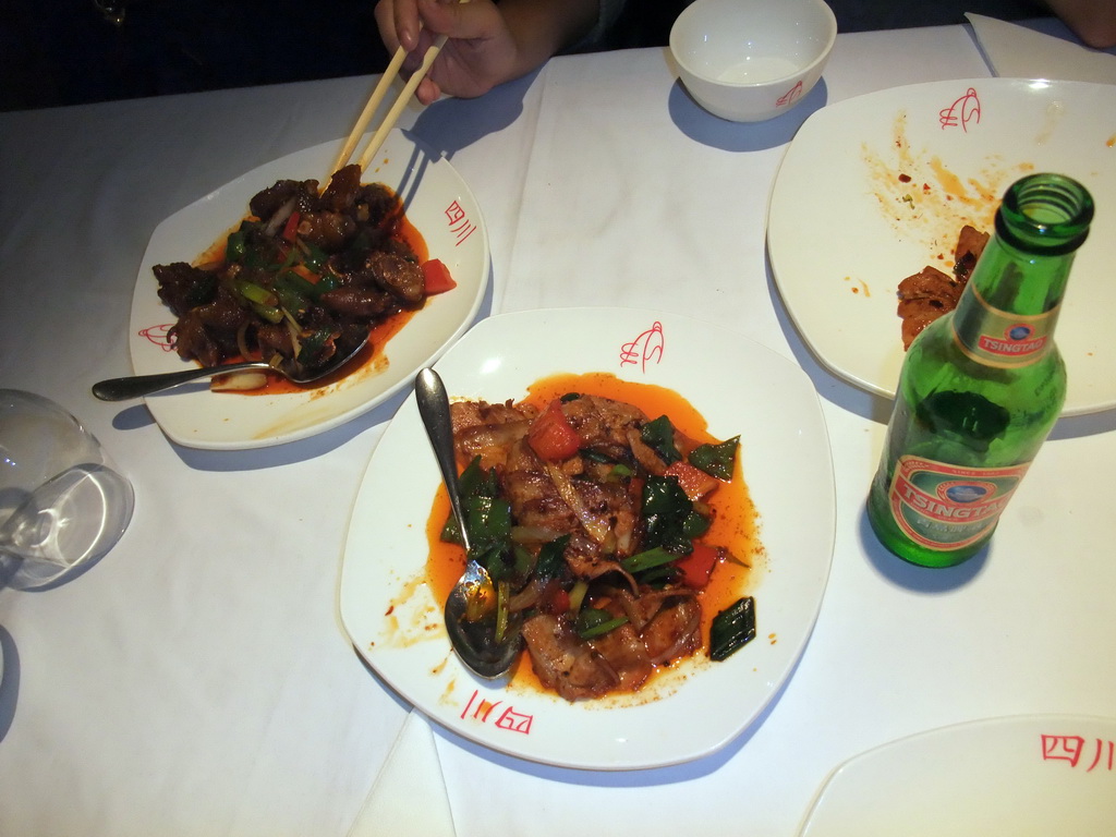 Dinner and Tsingtao beer at the `L`Olla de Sichuan` restaurant at the Carrer d`Aragó street
