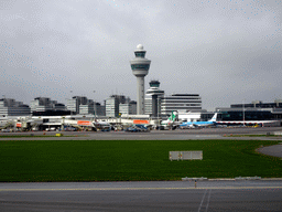 Airplanes and control tower at Schiphol Airport, viewed from the airplane from Amsterdam