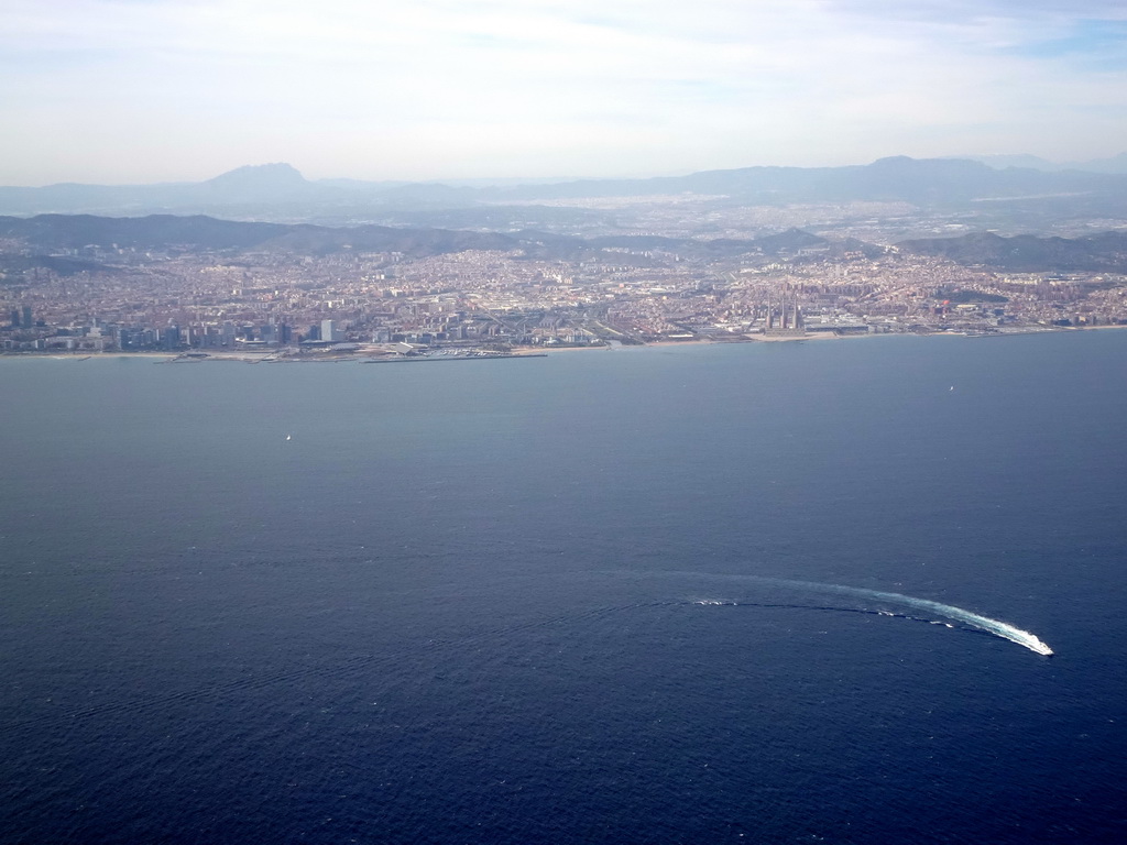 The east side of the city with the Port Fòrum harbour and the Parc Fluvial del Besòs park, viewed from the airplane from Amsterdam