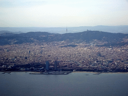 The city center with the Port Olímpic harbour, the Sagrada Família church and the Tibidabo mountain with the Sagrat Cor church, viewed from the airplane from Amsterdam