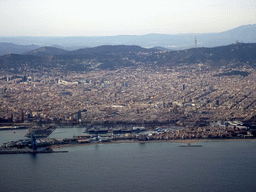The city center with the Sant Sebastià and La Barceloneta beaches, the Port Vell harbour and the Tibidabo mountain with the Sagrat Cor church, viewed from the airplane from Amsterdam