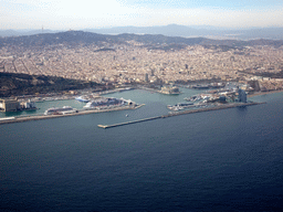 The city center with the Port Vell harbour, the Montjuïc hill and the Tibidabo mountain with the Sagrat Cor church, viewed from the airplane from Amsterdam