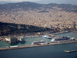 The city center with the Port Vell harbour, the Montjuïc hill and the Tibidabo mountain with the Sagrat Cor church, viewed from the airplane from Amsterdam