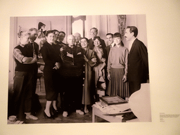 Photograph of Pablo Picasso and his family and friends, at the temporary exhibition `Pablo Picasso and the Publishers Gustavo Gili: Work and Friendship` at the Picasso Museum, with explanation