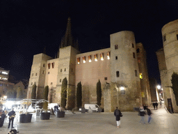 The Roman Wall and the tower of the Barcelona Cathedral at the Plaça Nova square, by night