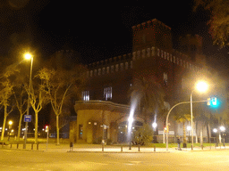 The northwest side of the Castle of the Three Dragons at the Passeig de Pujades street, by night