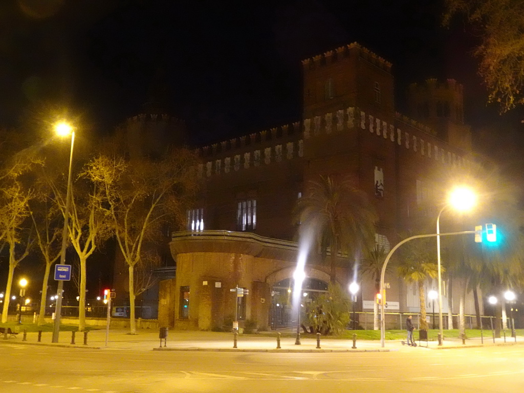 The northwest side of the Castle of the Three Dragons at the Passeig de Pujades street, by night