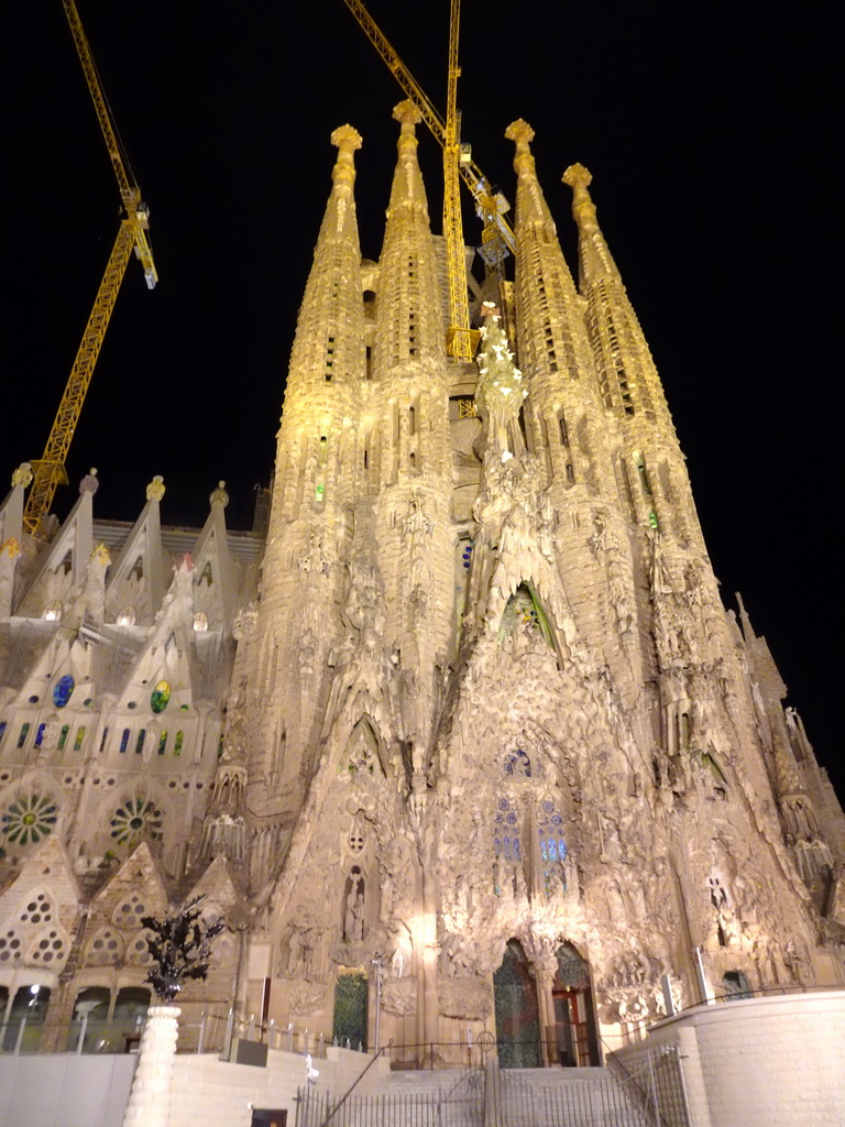 Northeast side of the Sagrada Família church with the Nativity Facade, under construction, viewed from the Carrer de la Marine street, by night