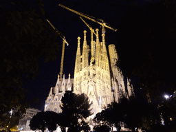 Northeast side of the Sagrada Família church with the Nativity Facade, under construction, viewed from the Plaça de Gaudí park, by night