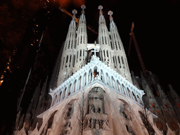 Southwest side of the Sagrada Família church with the Passion Facade, under construction, viewed from the Plaça de la Sagrada Família square, by night